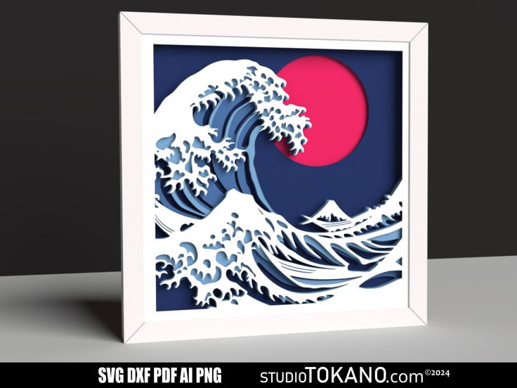 an origami art piece depicting the great wave in blue and pink with red sun behind it