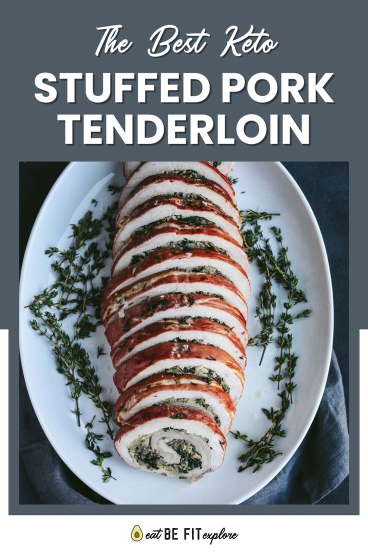 the best keto stuffed pork tenderloin on a white plate with fresh herbs