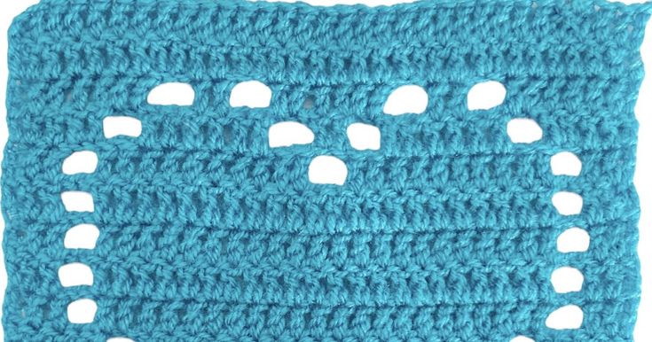 a crocheted square with holes in the middle