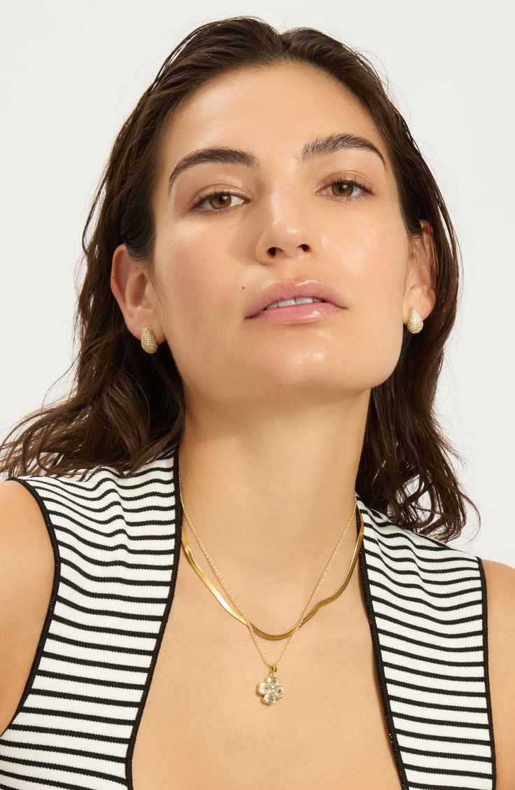 A clover pendant necklace crafted in 14-karat-gold or silvertone plate is a must-have staple for your collection. 15" length; 4" extender; 1/2"W x 1/2"L pendant 14k-gold plate or silvertone plate/glass Imported Gold-tone Clavicle Chain Charm Necklace, Gold Plated Charm Necklace With Pearl Pendant, Gold-tone Initial Pendant Charm Necklaces, Modern Gold-tone Necklace, Classic Chain Necklace With Round Pendant, Chic Gold Charm Necklace With Pearl Pendant, Tarnish Resistant Yellow Gold Charm Necklace, Elegant Plated Charm Necklaces, White Tarnish-resistant Charm Necklace