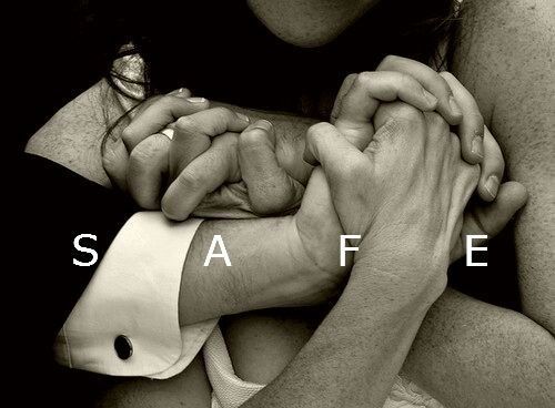 two people holding each other with the words safe in front of them and an image of their hands