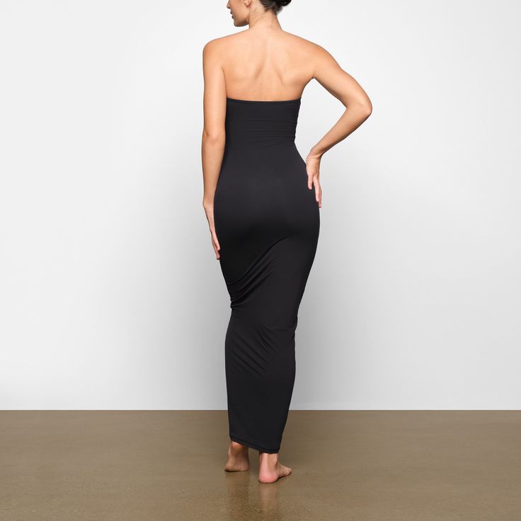 This buttery-soft and stretchy strapless maxi dress will become your go-to for all your plans, double-lined with Fits Everybody fabric for a flattering, body-hugging fit. Fits true to size. | SKIMS Tube Dress | Black | Large | Fits Everybody Strapless Stretch Smoothing Shapewear, Strapless Stretch Elastane Maxi Dress, Solid Strapless Smoothing Tube Top, Strapless Solid Tube Top With Smoothing, Fitted Smoothing Bandeau Shapewear, Fitted Seamless Maxi Dress For Night Out, Versatile Stretch Dresses For Night Out, Solid Smoothing Strapless Tube Top, Strapless Smoothing Tube Top