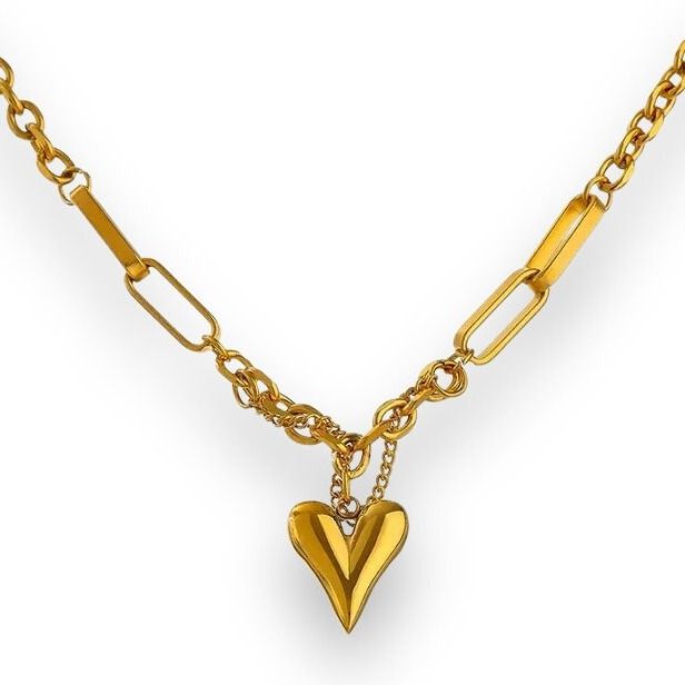 Exquisite Elegance and Unmatched Quality The Nadia Heart Necklace is the epitome of elegance and quality. Crafted from 18K PVD Gold Stainless Steel, the necklace features a captivating heart pendant and a sturdy lobster claw clasp. The necklace is 18.5" long and comes with a 2" extension, allowing for a personalized fit. Available in luxurious gold or classic silver Crafted from 18K PVD Gold Stainless Steel Varied lengths (14", 16", 18") with a 2" extender Nickel, Lead and Cadmium free Water and