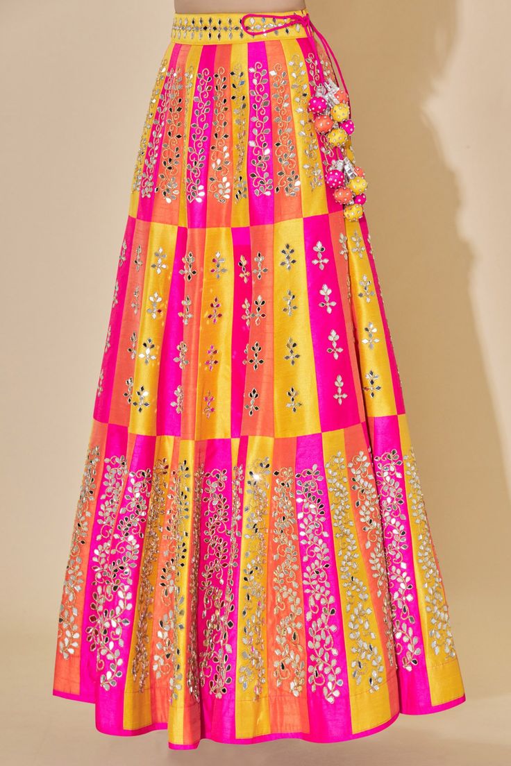 Peach high-waist lehenga with mirror embellished motifs. Comes with blouse and sheer dupatta.
Components: 3
Fabric: Dupion Raw Silk
Neckline: V neck
Sleeve Length: Sleeveless
Color: Peach
Embellishment
Mirror embellished motifs on blouse
Deep back on blouse with tassel tie-up detail
Mirror motifs on dupatta
Mirror embellished motifs on dupatta border
Side tassel tie-up detail on lehenga
Closure: Concealed side zip placket on lehenga - Aza Fashions Floor-length Embellished Multicolor Sharara, Floor-length Multicolor Embellished Sharara, Multicolor Embellished Floor-length Sharara, Multicolor Embellished Saree Set, Embellished Multicolor Saree Set, Multicolor Embellished Sets For Reception, Embellished Multicolor Sets For Reception, Festival Lehenga With Mirror Work And Traditional Drape, Multicolor Embellished Floor-length Anarkali Set