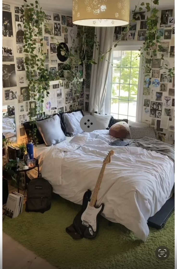 a bed room with a guitar on the floor