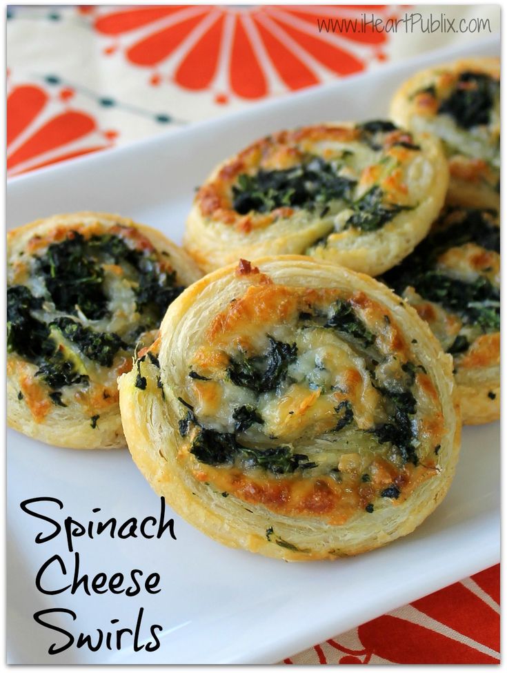 spinach cheese swirls on a white plate