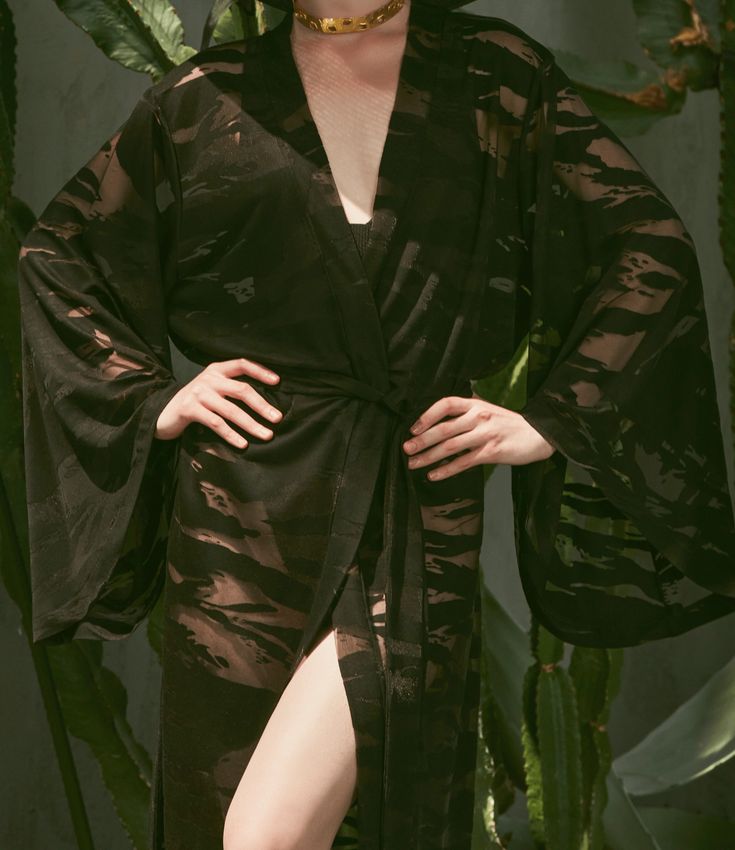 Introducing Our Elegant Long Beach Kimono Looking for a versatile and elegant beach robe you can wear around the pool and out to glamorous events? Introducing the Lydia long beach robe from Patara Life. Our long beach kimonos are a beautiful addition to any beach or poolside wardrobe worn over swimwear. It features luxurious patterned detailing, and is made of a flowing viscose / polyester (devore) sheer fabric that is sure to delight! The robe is perfect for covering up after a swim or keeping Chic Summer Party Kimono, Spring Party Robe With Open Front, Open Front Robe For Spring Party, Spring Open Front Party Robe, Black Summer Beach Robe, Long Summer Party Robe, Chic Summer Evening Robe, Black Long Beachwear Kimono, Long Black Beachwear Kimono