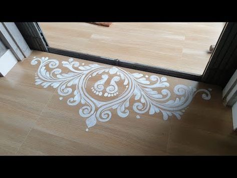 the floor is covered with white stencils in front of an open glass door