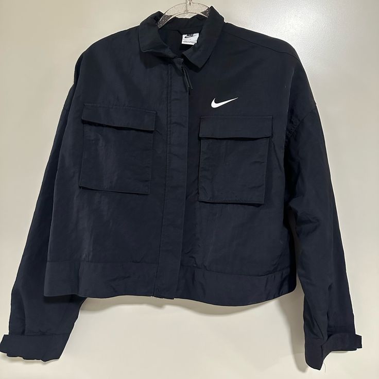 Nike Cargo Crop Jacket Black Brand New Size Small Multiple Pockets Casual Nike Tops With Pockets, Sporty Utility Jacket For Workwear, Sporty Long Sleeve Utility Jacket For Work, Nike Athleisure Outerwear With Pockets, Functional Utility Jacket, Spring Nike Track Jacket With Pockets, Casual Nike Track Jacket With Pockets, Nike Sporty Outerwear For Casual Wear, Tops Nike