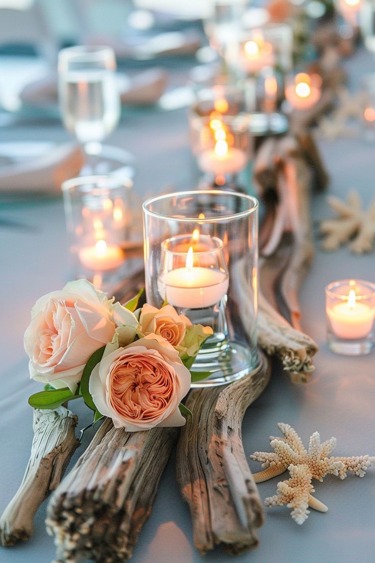 the table is set with candles and flowers