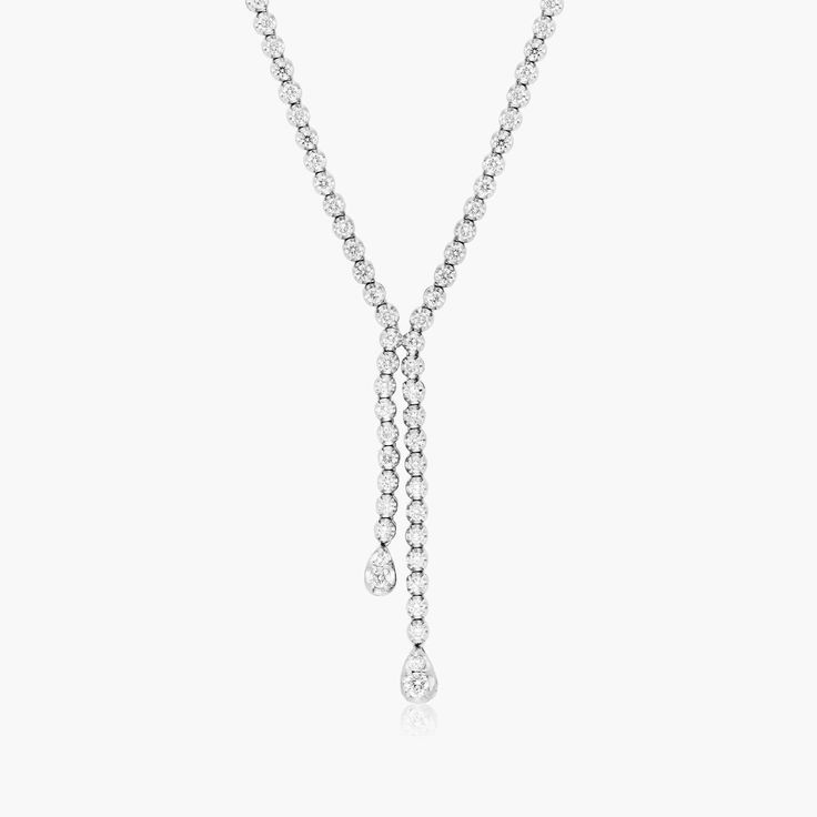 14K White Gold Lariat Diamond Necklace. This stunning lariat necklace will bring the sparkle and utmost elegance to your neckline. White Gold Lariat Diamond Necklace, Anniversary Diamond Lariat Necklace, White Gold Lariat Diamond Necklace For Formal Occasions, Formal Lariat Diamond Necklace In Fine Jewelry Style, Formal Lariat Diamond Necklace Fine Jewelry, Formal Lariat Diamond Necklace, Formal White Gold Lariat Diamond Necklace, Fine Jewelry Diamond Lariat Drop Necklace, Luxury Lariat Necklace With Brilliant Cut For Formal Occasions