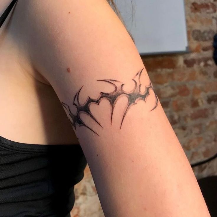 a woman with a tattoo on her arm