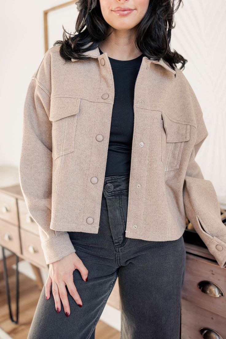 Double your style options with the Emma Crop Shacket. This versatile piece can be worn as a shirt or jacket, giving you a relaxed fit and a neutral color that pairs perfectly with any outfit. Model is 5'4 wearing a size small S 2-4, M 6-8, L 10-12 Cropped length Relaxed fit Collared neckline Front button down closure Front chest pockets Can be worn open or closed Fall Button-up Tops With Side Pockets, Trendy Winter Tops With Pockets, Casual Fall Tops With Buttoned Pockets, Casual Tops With Buttoned Pockets For Fall, Solid Single Breasted Top For Fall, Fall Tops With Buttoned Pockets For Everyday, Solid Single-breasted Top For Fall, Casual Single Breasted Tops For Fall, Long Sleeve Tops With Flap Pockets For Fall