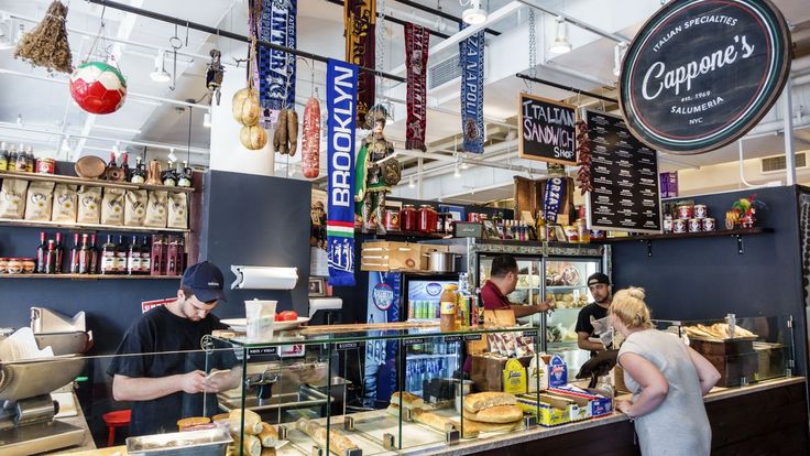 the inside of a restaurant with customers ordering food