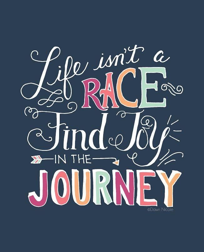 the words life isn't a race find joy in the journey on a dark background