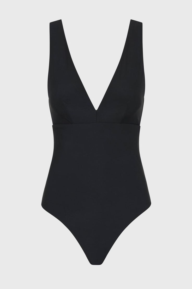 The Lecco One Piece in Black features a flattering, plunge V neck and a supportive, under-bust seam. A classic, minimal swimsuit, Lecco is crafted from our luxury, Italian Sculpteur® fabric﻿, with a patented 3-D stretch that supports and flatters the silhouette. With wide, comfortable shoulder straps and assistance with tummy control, Lecco delivers ease and body confidence. Lecco has regular bottom coverage and is suitable for larger busts up to cup size DD. Fabric sustainably made in Italy.Garment sustainably made in Australia. Elegant Swimsuit, Resort Wear Dresses, Matching Separates, Luxury Swimwear, Dd Cup, Body Confidence, Black Features, Black One Piece, Designer Swimwear