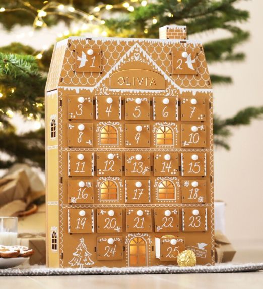 a gingerbread house shaped like a christmas tree with the number twenty five on it