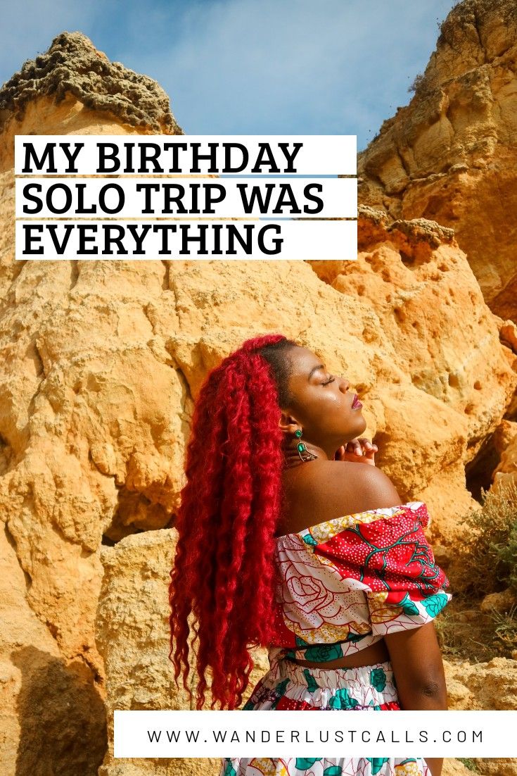 a woman with red hair standing in front of rocks and text that reads, my birthday solo trip was everything