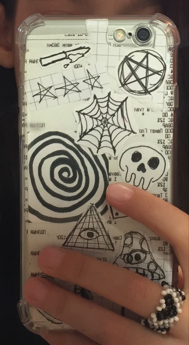 someone holding up their phone case with drawings on it