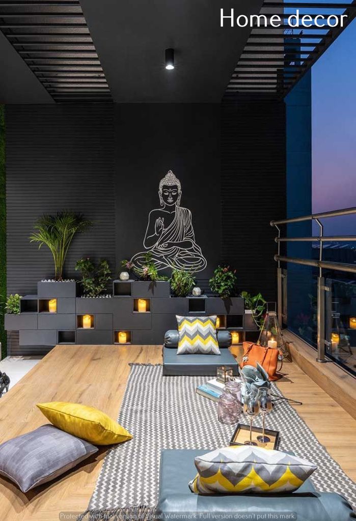 a living room filled with lots of furniture next to a wall covered in buddha artwork