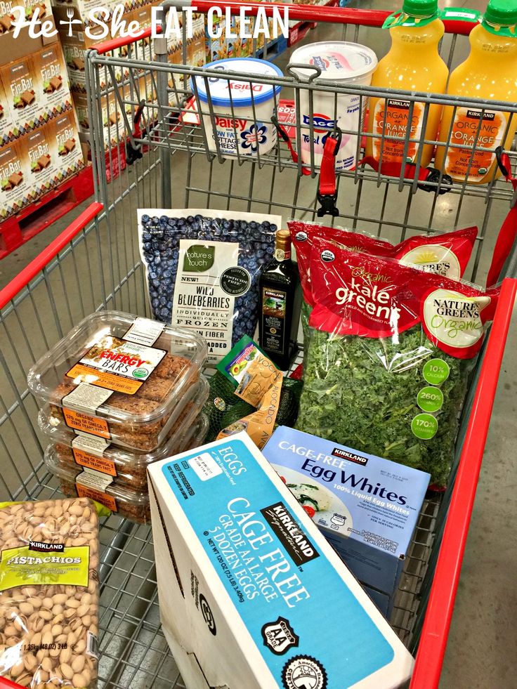 a shopping cart filled with food and drinks