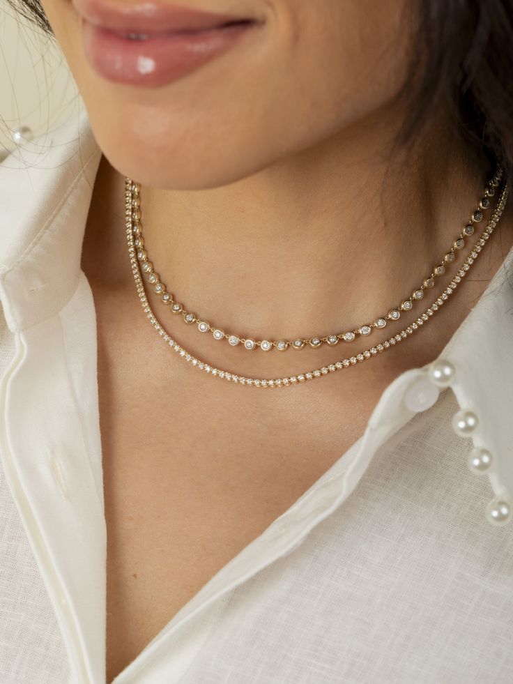 Indulge in everyday luxury with our Cupcake Diamond Tennis Necklace. Featuring a crown prong setting that beautifully showcases approximately 2 carats of dazzling diamonds, this necklace is the perfect blend of elegance and sparkle. Ideal for layering or wearing solo, it adds a touch of refined sophistication to any outfit, from casual chic to evening glamour. Everyday Luxury Diamond White Tennis Necklace, Dazzling Diamond Necklace For Everyday Luxury, Dazzling Everyday Luxury Diamond Necklace With Accents, Cubic Zirconia Diamond Necklace For Everyday Luxury, Fine Jewelry Tennis Necklace With Single Cut Diamonds, Dazzling Everyday Luxury Tennis Necklace With Round Cut, Fine Jewelry Round Cut Tennis Necklace For Everyday Luxury, Dainty Tennis Necklace With Brilliant Cut, Dainty Round Cubic Zirconia Tennis Necklace