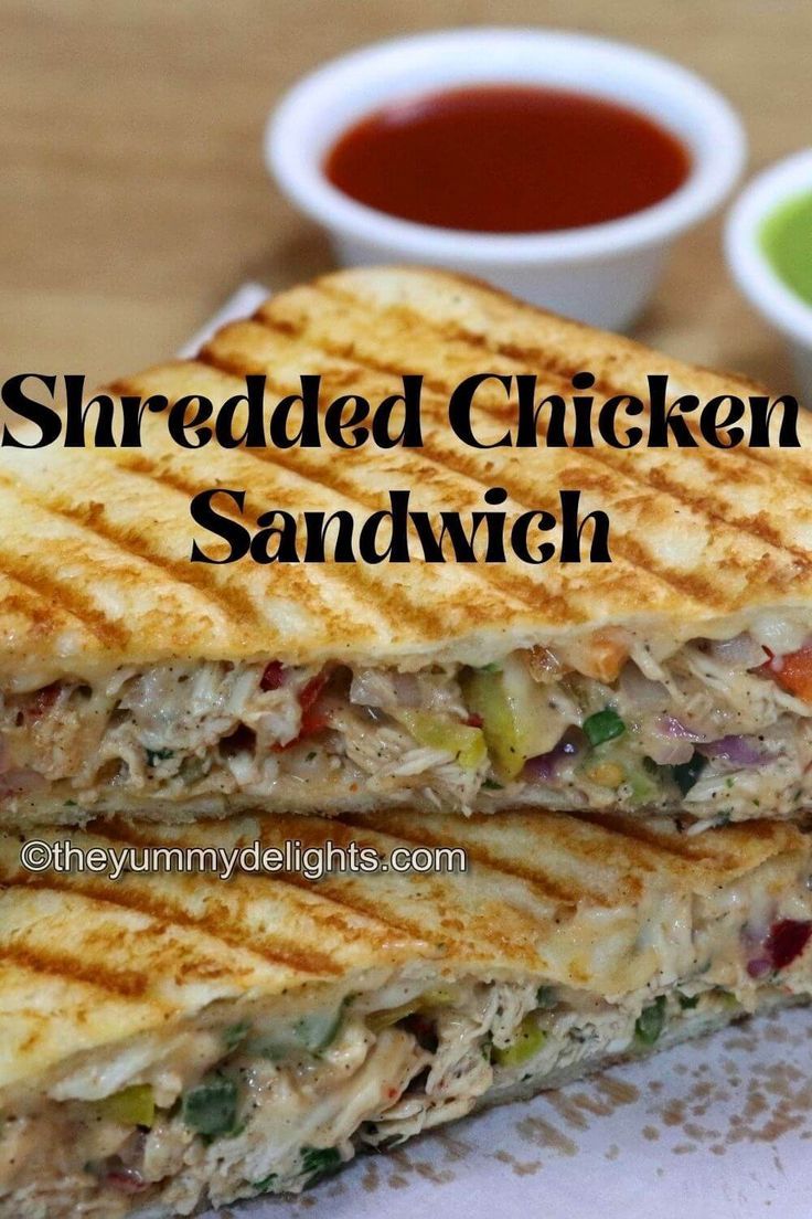 close-up of shredded chicken sandwich stacked on a board. Chicken Sandwich Filling, Chicken Mayonnaise, Sandwich Recipe Videos, Shredded Chicken Sandwiches, Grilled Sandwich Recipe, Chicken Breast Sandwich, Easy Breakfast Sandwich, Chicken Sandwich Recipe, Pan Chicken Recipes