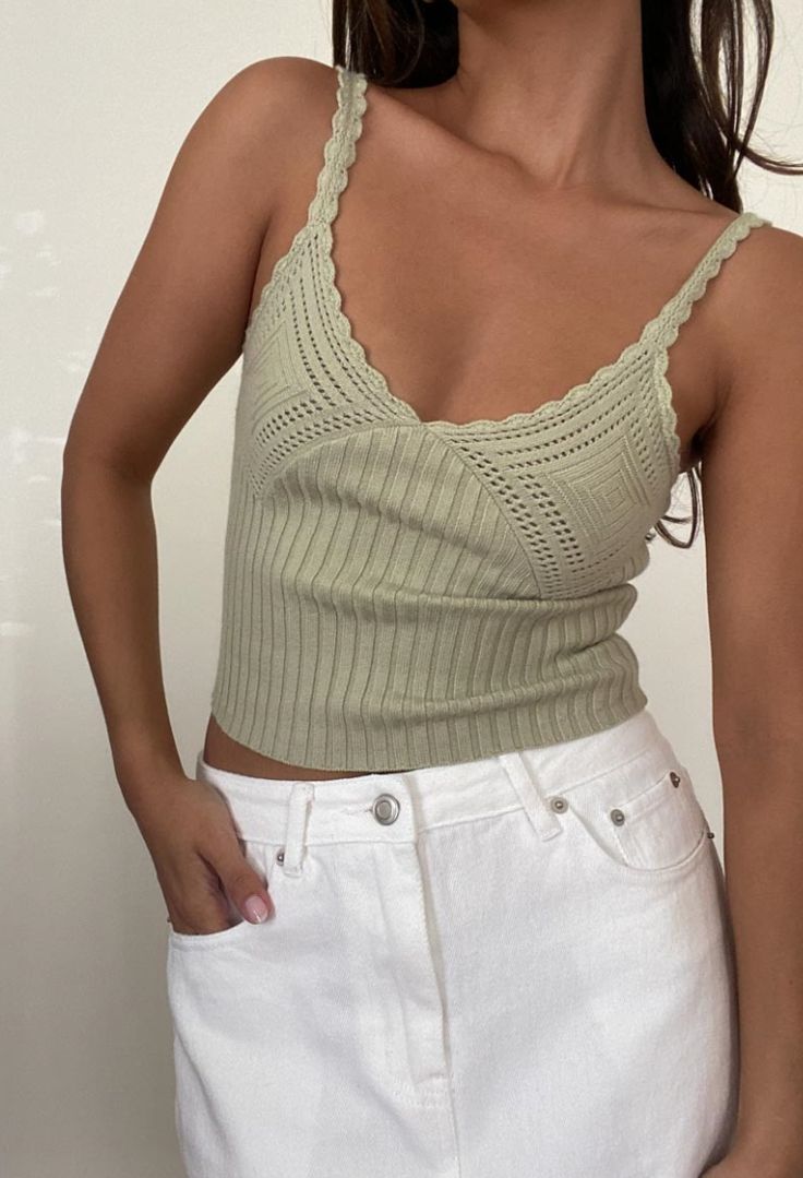 Expertly crafted with ribbed knit fabric, the 'Summer Day Matcha Top' offers a chic crochet detail, v-neckline, and cropped fit. Stay cool and stylish all season long in this versatile and comfortable top. Also available in the color Oat. Content & Care: 50% Viscose, 30% Nylon, 20% Polyester Dry clean only Ribbed Tank Top Outfit, Practical Outfits, Practical Style, Chic Crochet, Green Clothing, Practice Outfits, Tank Top Outfits, Summer Sweaters, Summer Glow