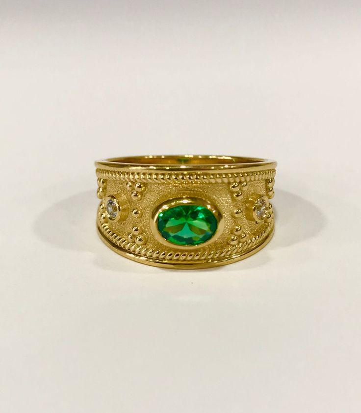 An Eye-Catching Medieval Ring with Shiny Gemstones on top. Gold Byzantine Ring- Emerald Ring - Medieval Ring - Etruscan Ring - Danelian Jewelry Following fine techniques to bring to life according to Etruscan & Byzantine design. ◾ Dimensions: 10.5mm width at the top. ◾ Bottom: 4.5mm width ◾ Materials: Choose your desired material for your ring, (Sterling Silver 925, 9K Solid Gold, or 14k Solid Gold). 18K Solid Gold option is also available, message us! Sterling Silver 925 option is available Byzantine Gold Emerald Ring For Anniversary, Byzantine Style Yellow Gold Emerald Ring For Anniversary, Byzantine Yellow Gold Emerald Ring For Anniversary, Byzantine Gold Emerald Anniversary Ring, Byzantine Oval Gemstone Ring, Oval Byzantine Gemstone Ring, Byzantine Style Oval Anniversary Rings, Byzantine Oval Wedding Rings, Oval Byzantine Style Anniversary Rings