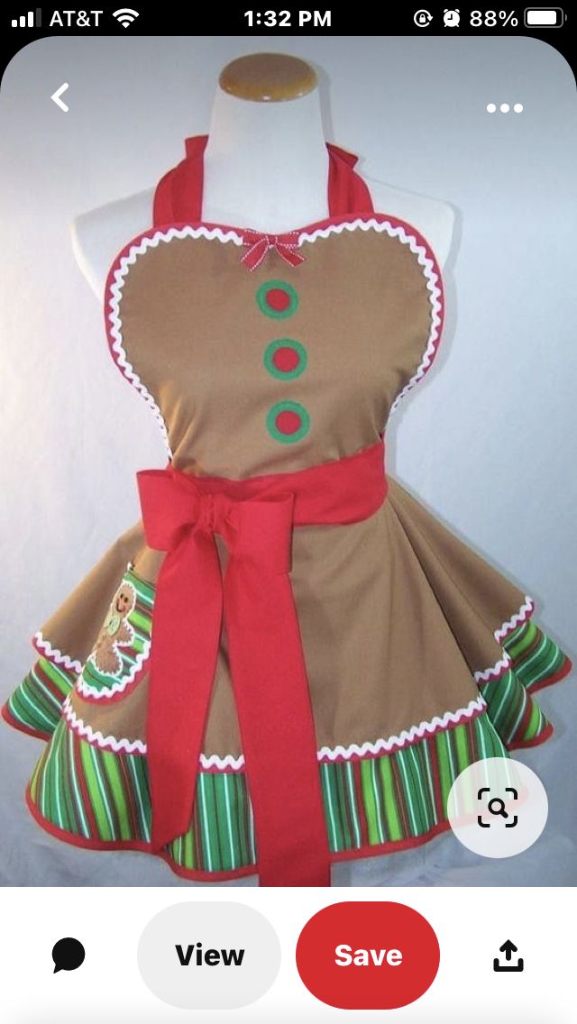 a dress made to look like a gingerbread christmas tree with green and red trim