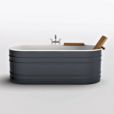 an old fashioned bathtub with a wooden stick sticking out of it