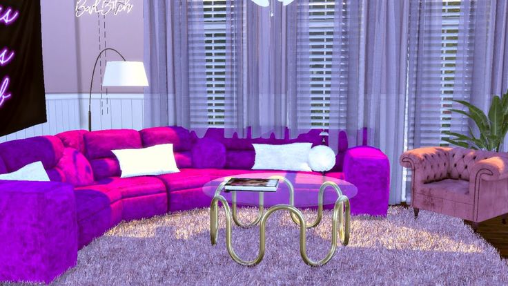 a living room filled with purple couches and pillows