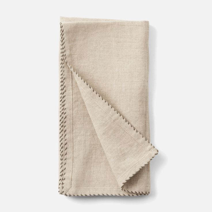 a folded linen napkin on a white background