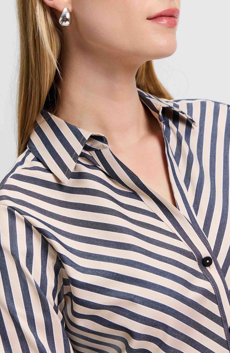 Look crisp and polished all day in this button-up shirt made from a non-iron cotton blend and finished with yarn-dyed stripes. 28" length (size 8) Front button closure Spread collar Long sleeves with button cuffs 58% cotton, 37% polyester, 5% spandex Machine wash, tumble dry Imported Pinstripe Collared Shirt For Work, Elegant Shirt With Vertical Stripes For Daywear, Workwear Shirt With Vertical Stripes And Spread Collar, Collared Shirt With Vertical Stripes For Work, Pinstripe Shirt With Placket For Work, Striped Blouse With Placket For Work, Office Shirt With Vertical Stripes And Collar, Pinstripe Collared Office Shirt, Chic Striped Shirt For Business Casual