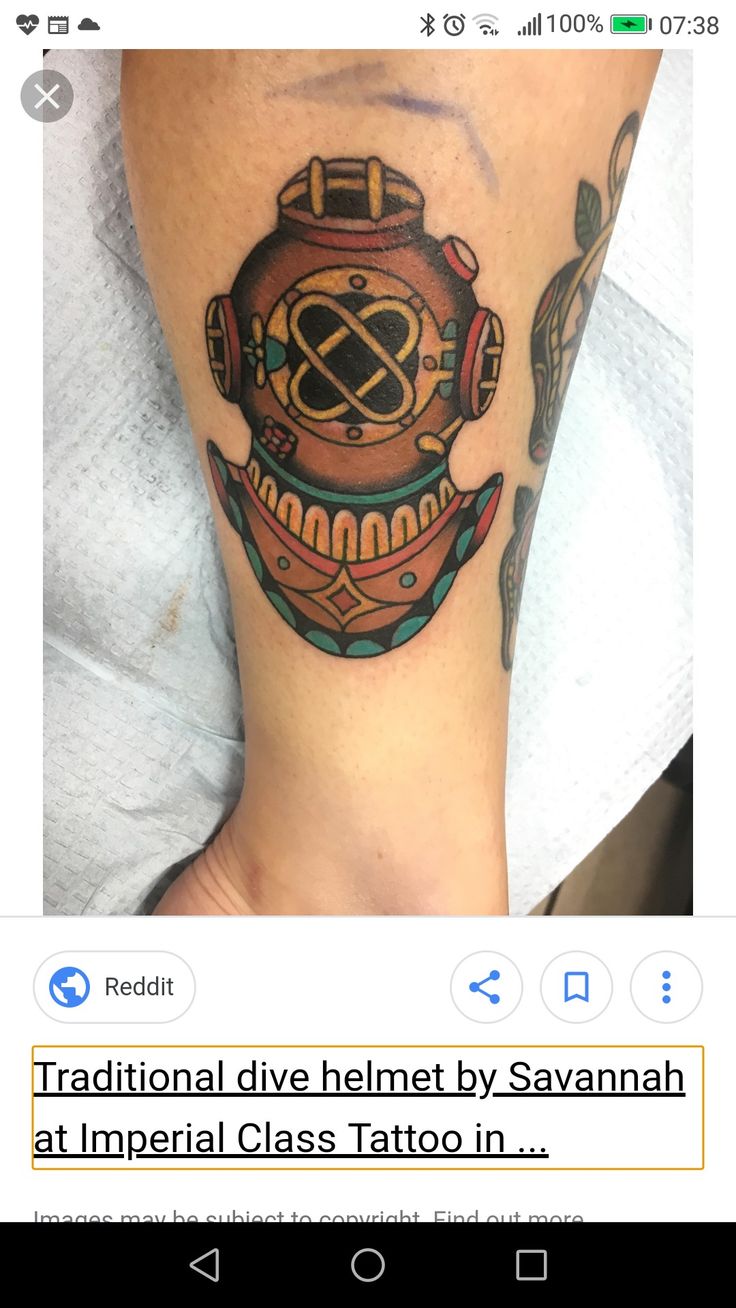 a person with a tattoo on their leg and the words traditional dive helmet by savannahn at imperial class tattoo in