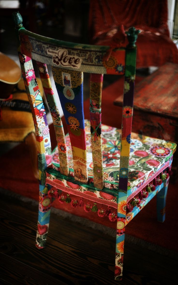 a chair made out of old magazines is shown in an image that appears to have been altered