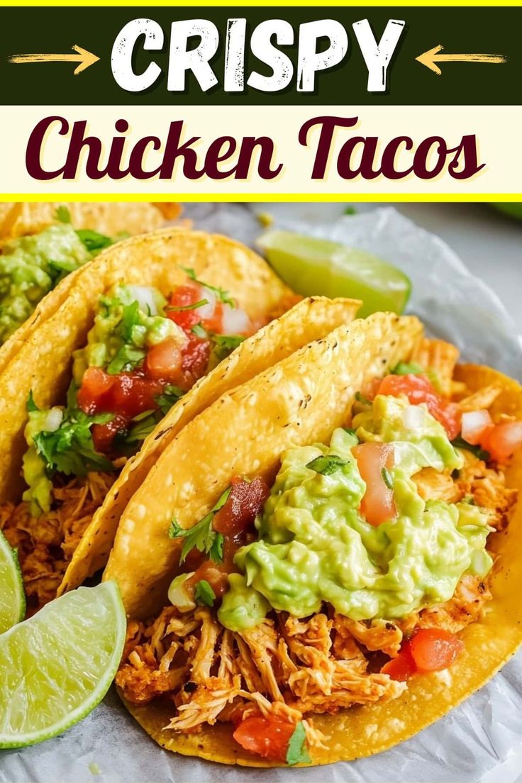 three chicken tacos with guacamole and salsa on top, sitting on a plate