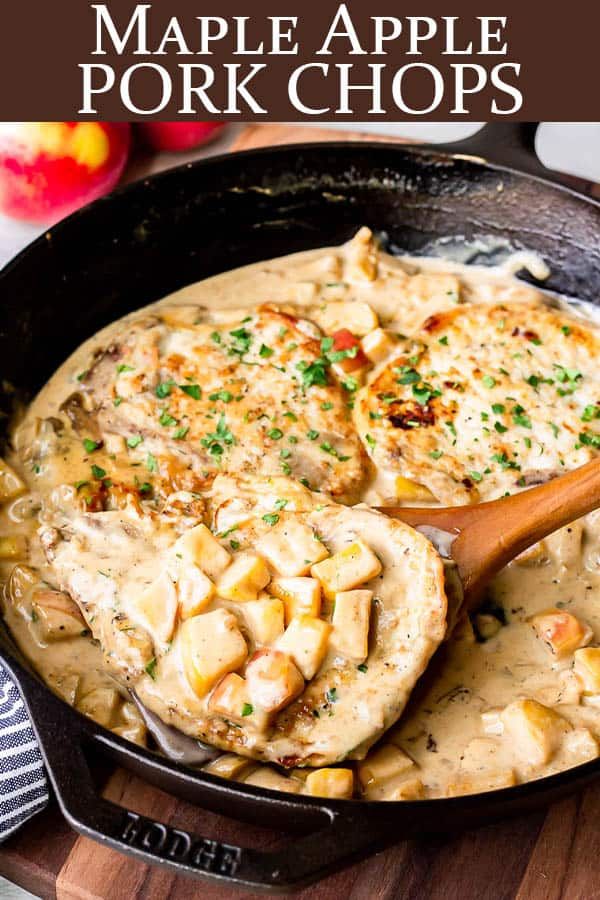 a skillet filled with pork chops covered in gravy