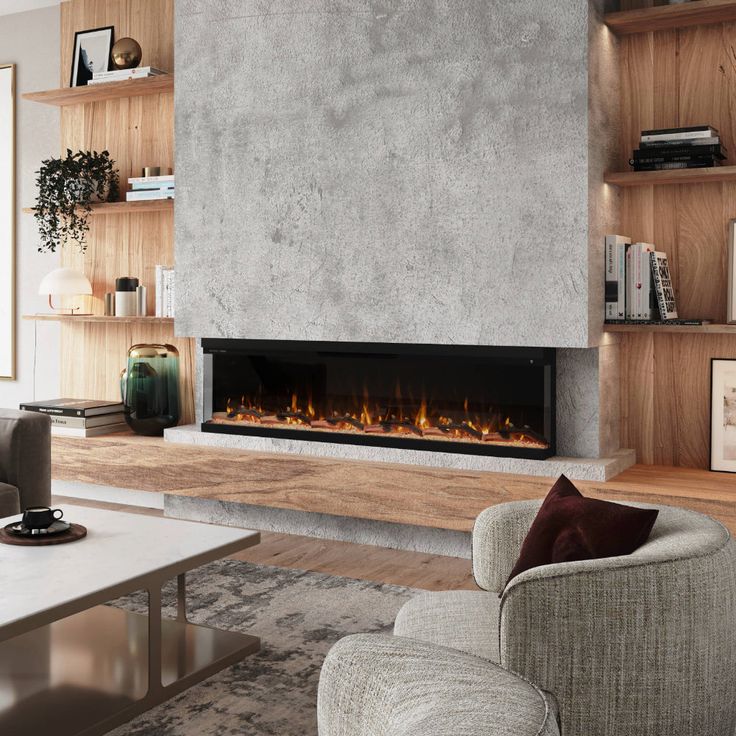 a living room with a large fireplace and two couches in front of the fire place