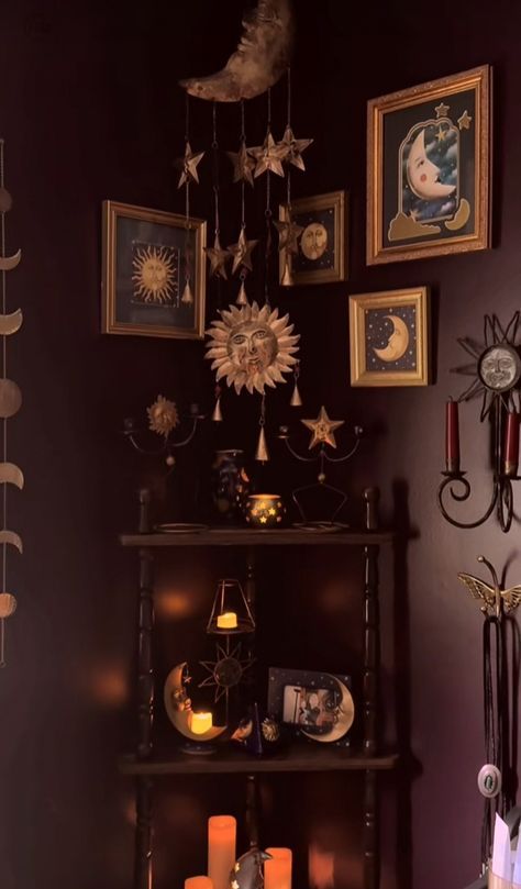 a shelf with candles and pictures on it in a room that is decorated with halloween decorations