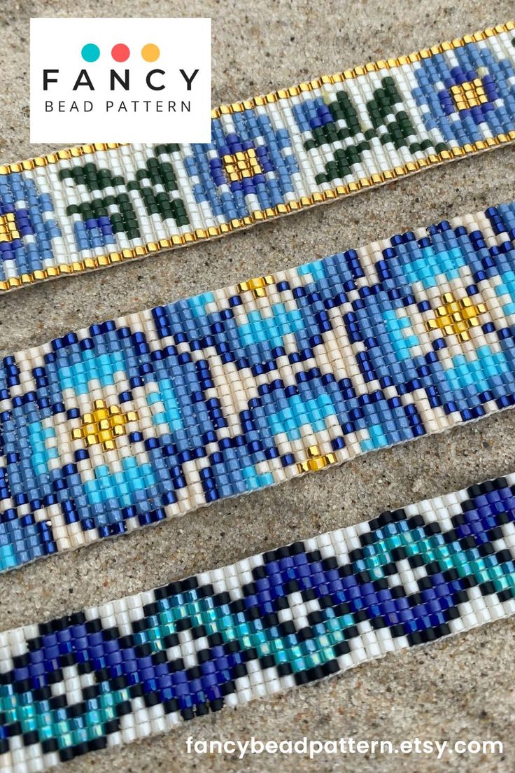 three bracelets with blue and green designs on them, one is beaded in gold