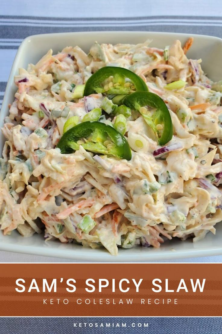 a white bowl filled with coleslaw salad on top of a blue table cloth