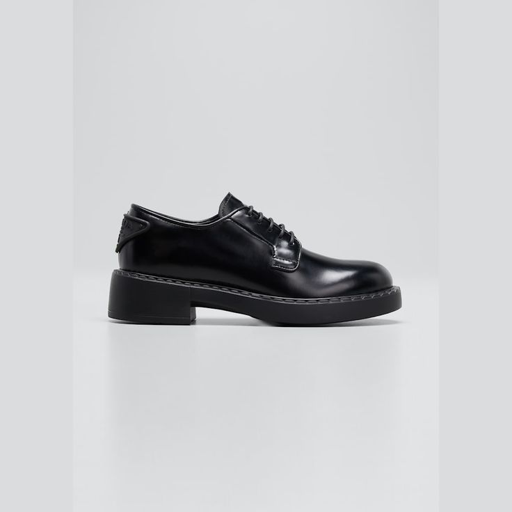 Prada derby loafers in calf leather 2.00 in / 50 mm flatform heel Almond toe Lace-up vamp Logo triangle at back  Leather/rubber outsole Made in Italy Elegant Lace-up Shoes With Lug Sole For Work, Designer Oxfords With Contrast Sole And Round Toe, Formal Low-top Platform Loafers With Lug Sole, Luxury Loafers With Contrast Sole For Work, Low-top Office Loafers With Lug Sole, Low-top Loafers With Lug Sole For Office, Luxury Lace-up Shoes With Lug Sole And Plain Toe, Office Low-top Loafers With Lug Sole, Elegant Slip-on Oxfords With Contrast Sole