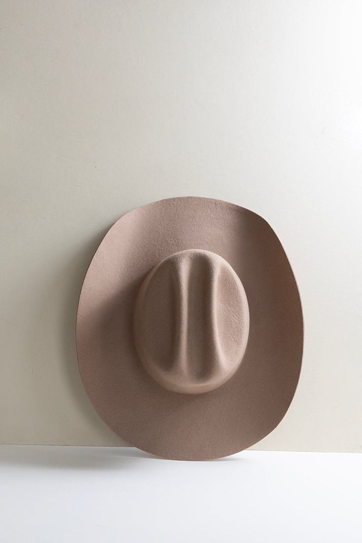 Classic. Cool. Totally on-trend. This beige, curled brim wool cowboy hat stands the test of time. Dress it up or down with the right mix of accessories from bands to feathers and pins. Details: 100-percent Australian wool Crown 4" Brim 4" Hidden adjustable band for fit flexibility See sizing chart Return policy Country Style Beige Hat Band For Western-themed Events, Country Style Beige Hat Bands With Curved Brim, Vintage Beige Hat Bands For Country Events, Beige Hats For Western-themed Events With Short Brim, Beige Short Brim Hat For Western-themed Events, Beige Brimmed Western Hat, Beige Wide Brim Hat For Rodeo, Western Beige Flat Brim Hat, Beige Rodeo Hat With Curved Brim