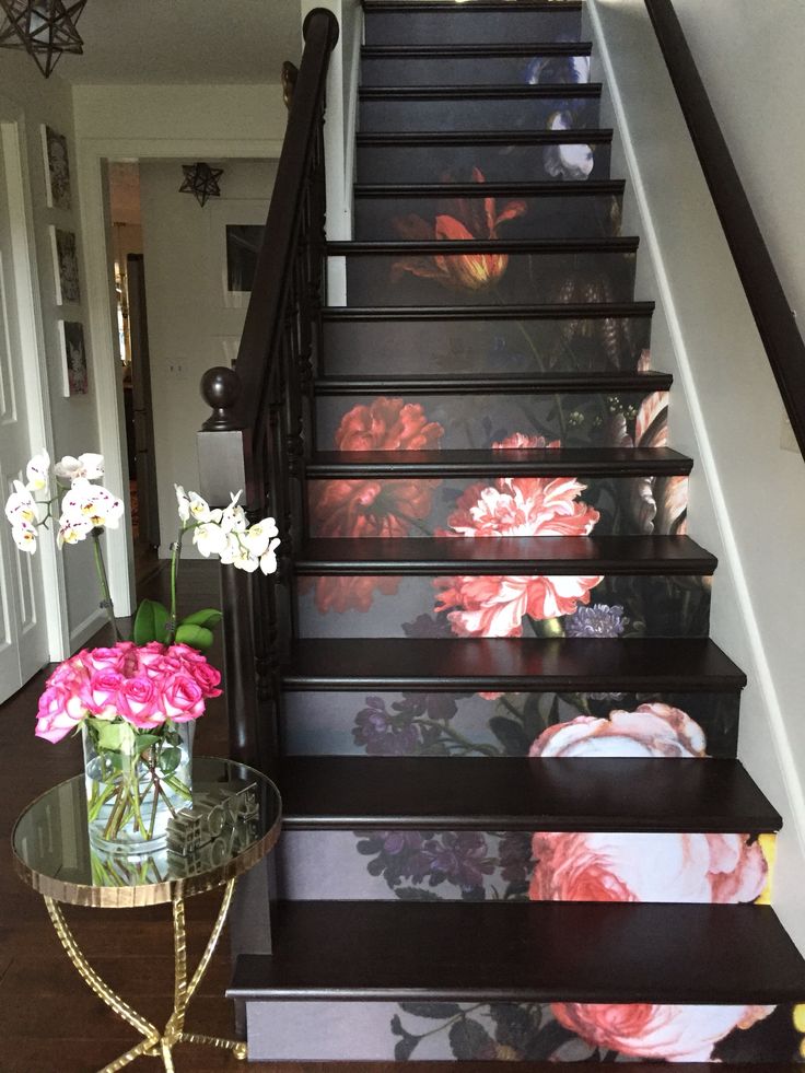 the stairs are painted with flowers on them