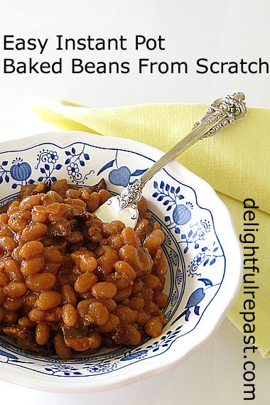 a bowl filled with baked beans on top of a table