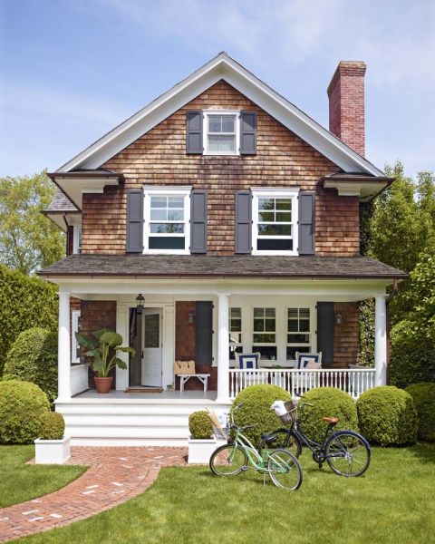 two bikes are parked in front of a house