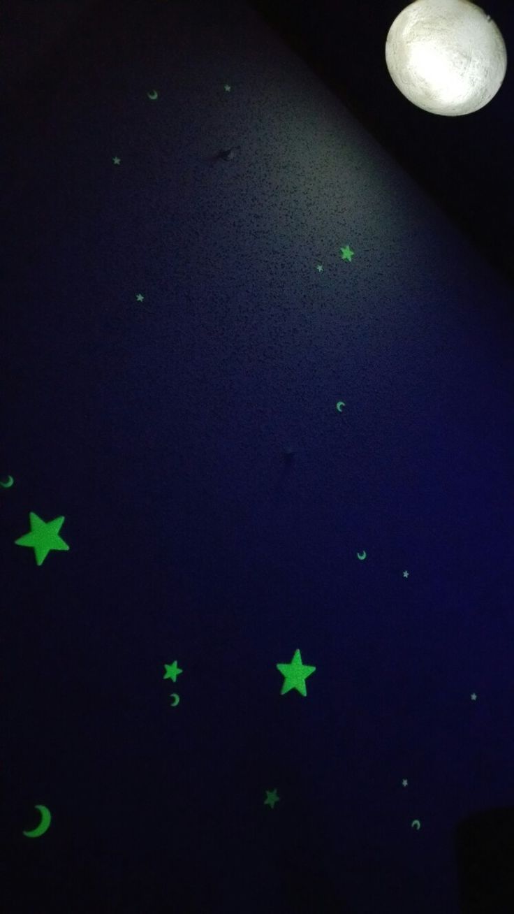 stars and moon glow in the dark night sky