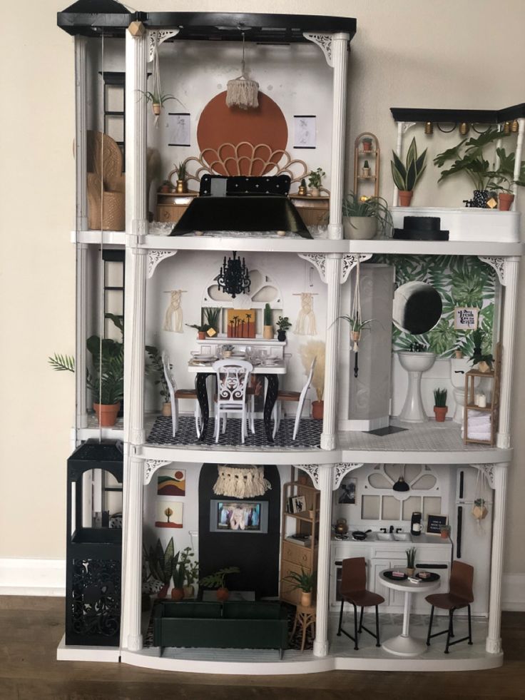 a doll house with all the furniture and accessories in it's display case is shown