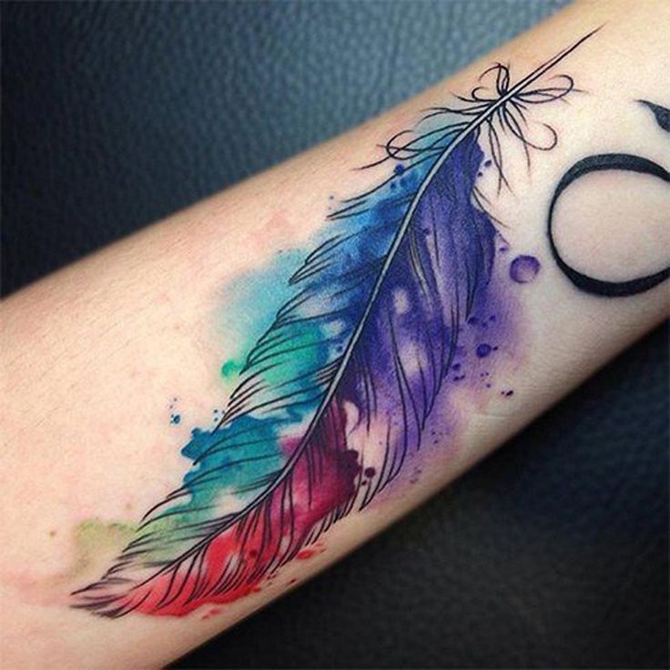 a colorful feather tattoo on the arm